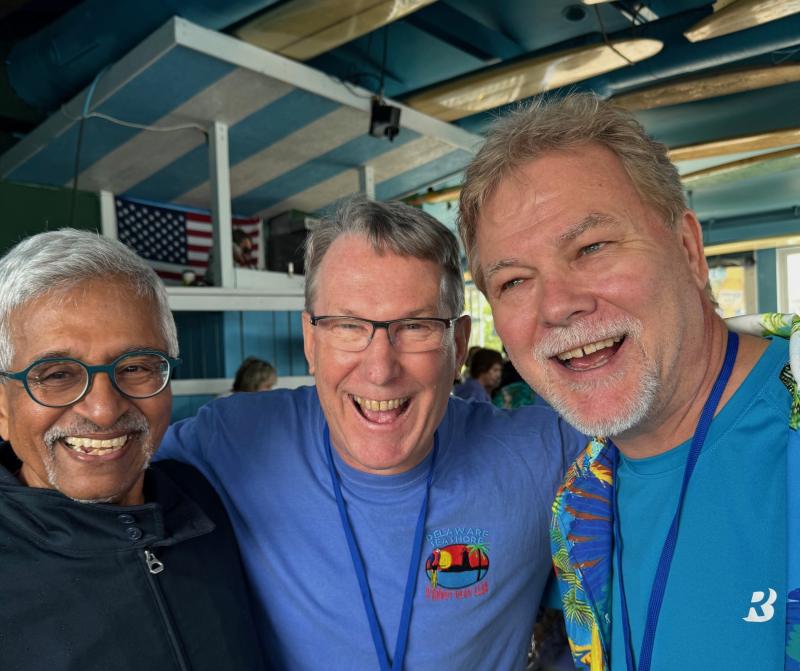 Delaware Seashore Parrot Head Club President Carle Foster joins bacchanal buddies Kannan Menon and Steve Wolf at the fundraiser. Shown are (l-r) Menon, Wolf and Foster.